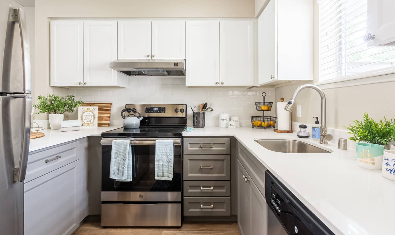 The kitchen at Lighthouse Apartments features stainless appliances.