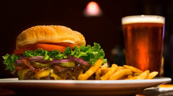 burger fries and beer, cheeseburger with bacon and pickles